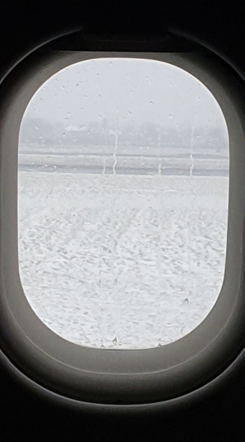 View of snow out an aeroplane window