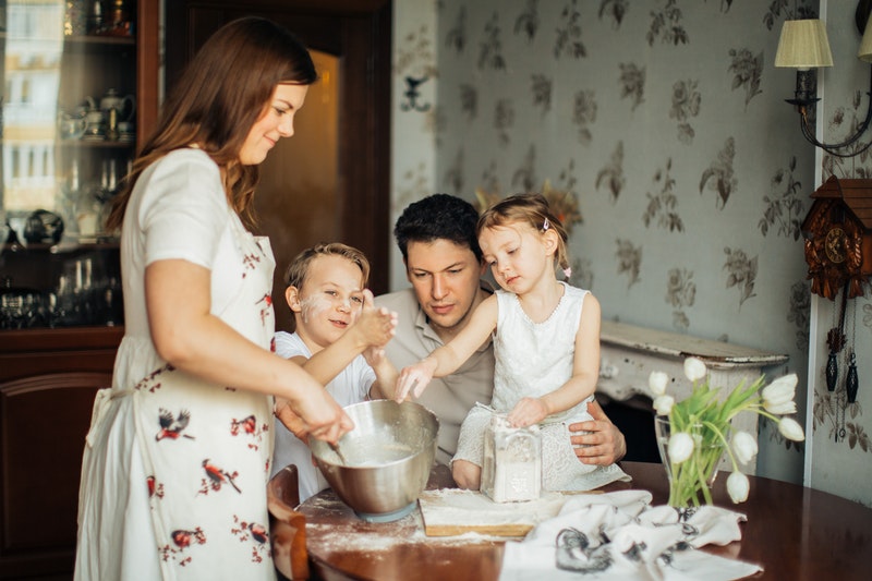 Family of four baking