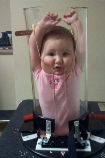 baby getting x ray in tube