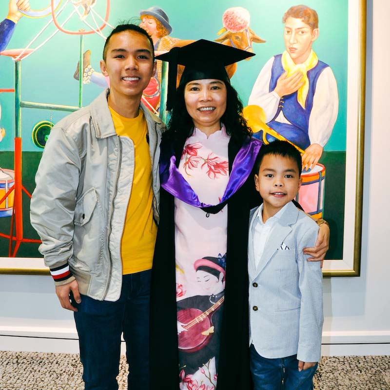 Thu Le with sons on graduation day