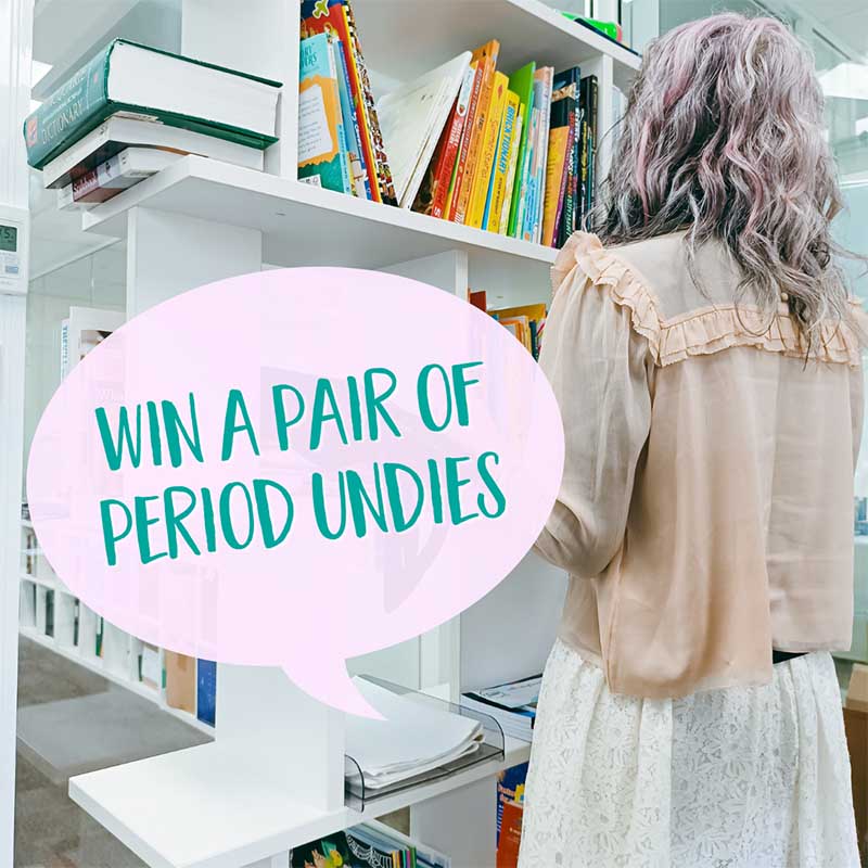 Back view of a lady standing in front of a bookcase. Text says Win a pair of period undies