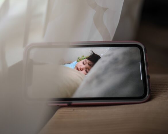 Phone taking a video of a child sleeping
