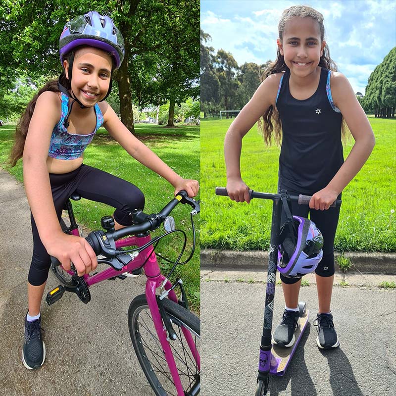 Photo of young girl on a bicycle and another on a scooter
